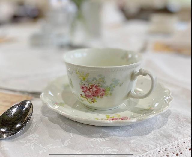 Tiered tea service with sandwiches, scones, and desserts